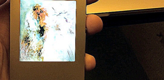 iPhone 5s со светящимся логотипом «Влюблённые» художника Вильяма Хенритса
